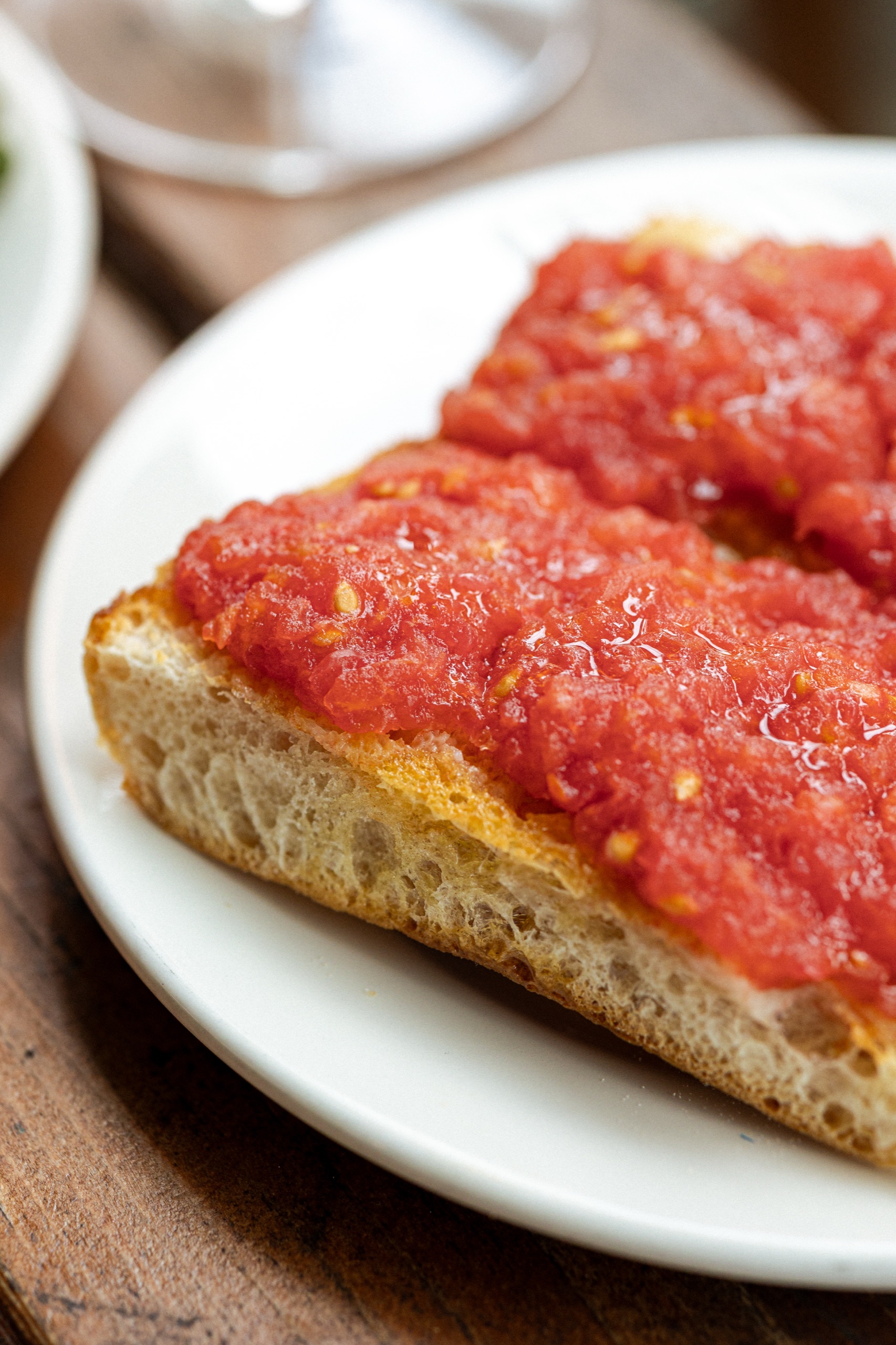 Pan con tomate — toasted ciabatta rubbed with garlic and tomato, drizzled with olive oil